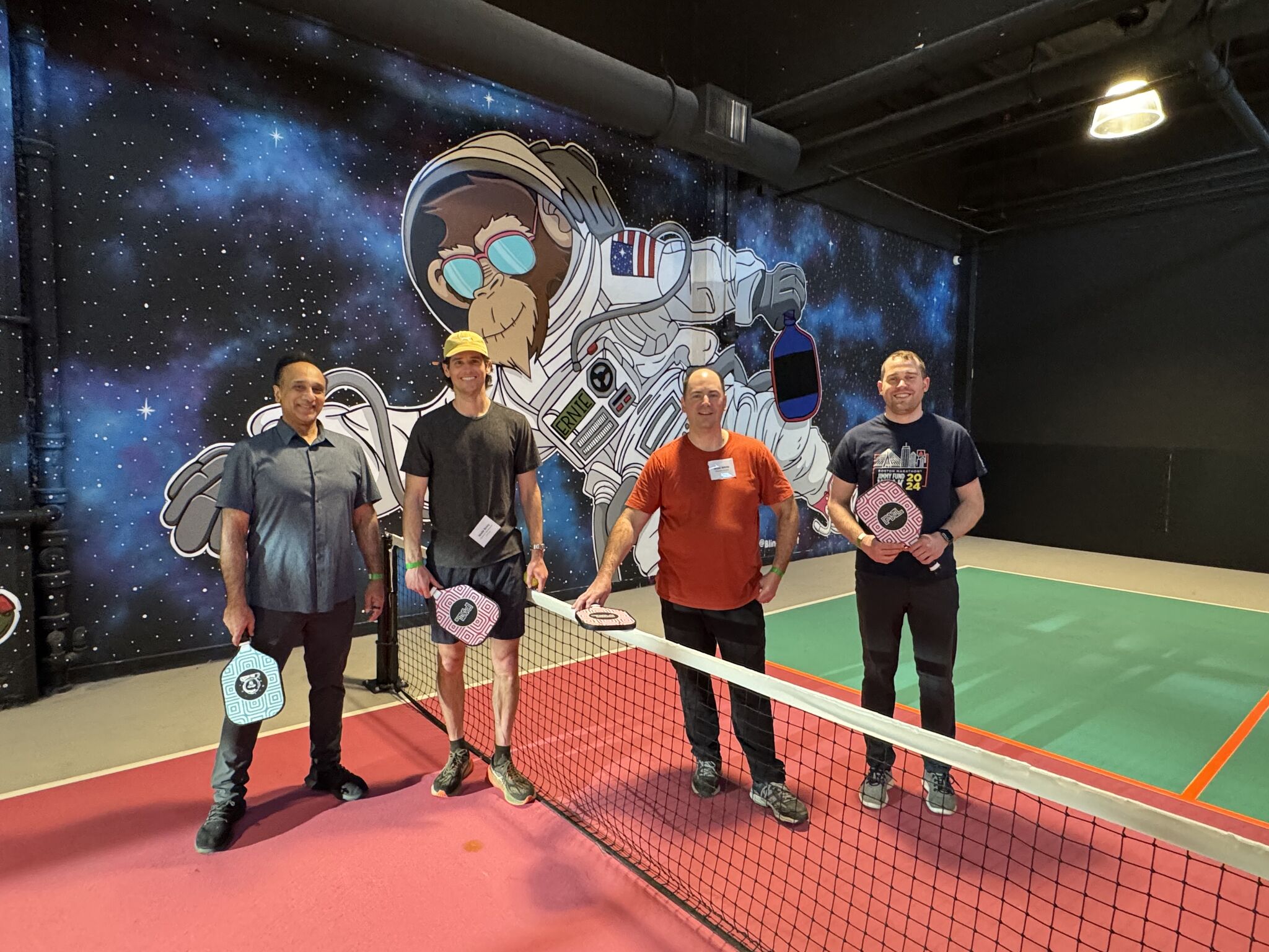 Photo of Parabilis team playing pickleball at the 2024 Winter Outing offsite